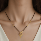 Elegant Gold-Toned Mangalsutra with Intricate Circular Pendant - BeMine