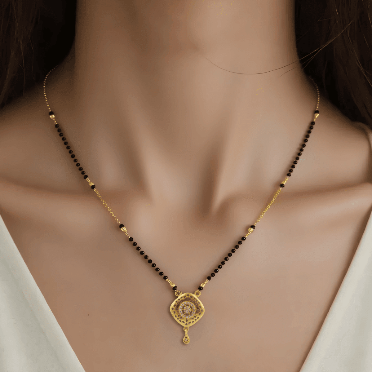 Elegant Gold-Toned Mangalsutra with Intricate Circular Pendant - BeMine