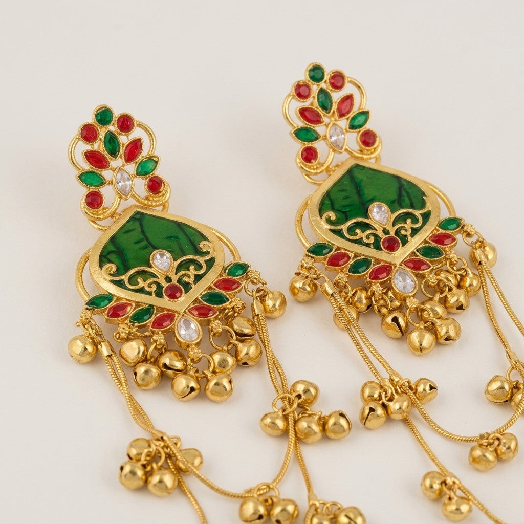 Detailed view of the back side of gold-tone drop earrings with multiple chains and dangling beads