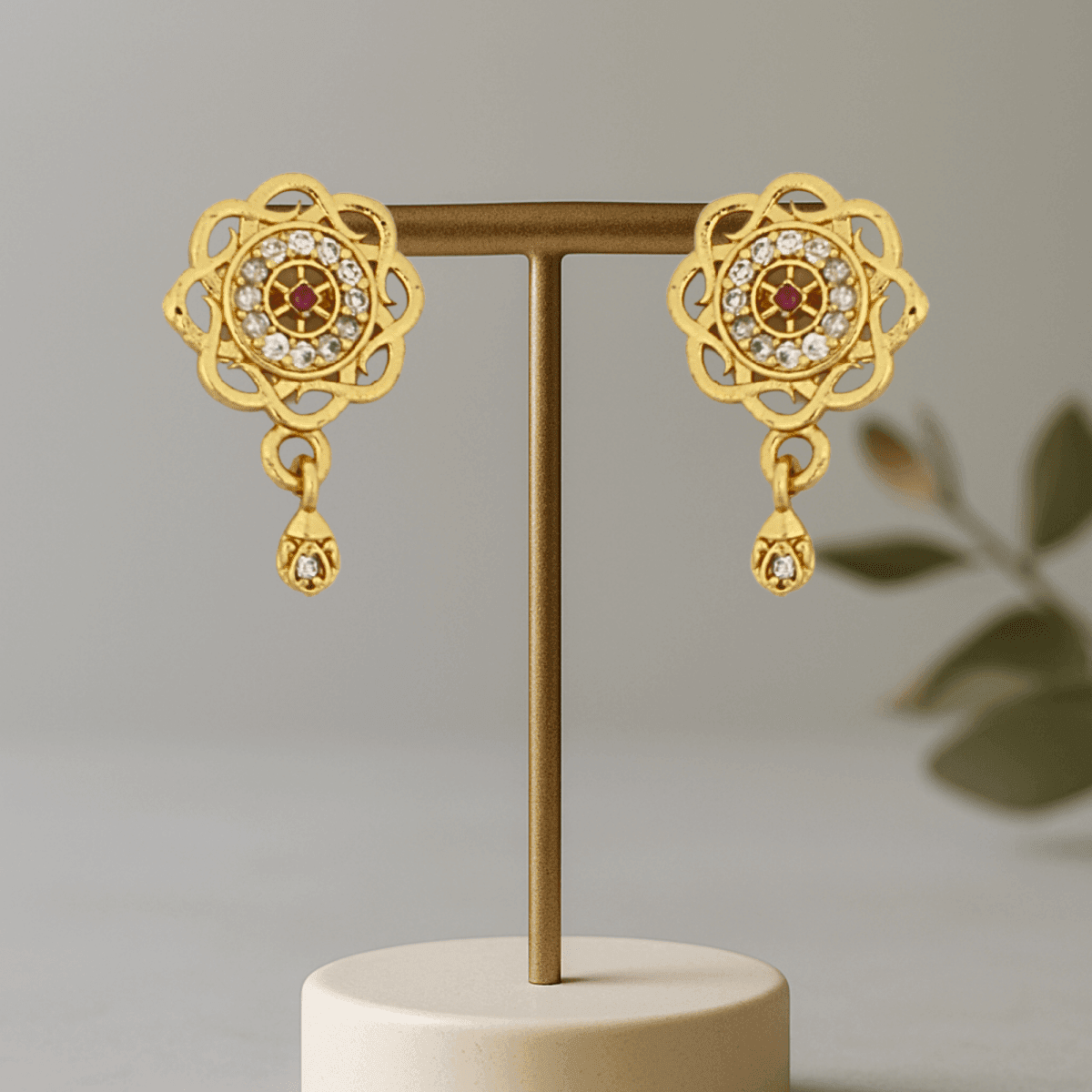 Radiant Floral Gold Plated Stud Earrings with Red Stone Center - BeMine