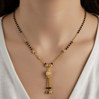 Traditional Gold-Plated Long Mangalsutra with Hanging CZ Ball Pendant & Ghungroo Tassels - BeMine